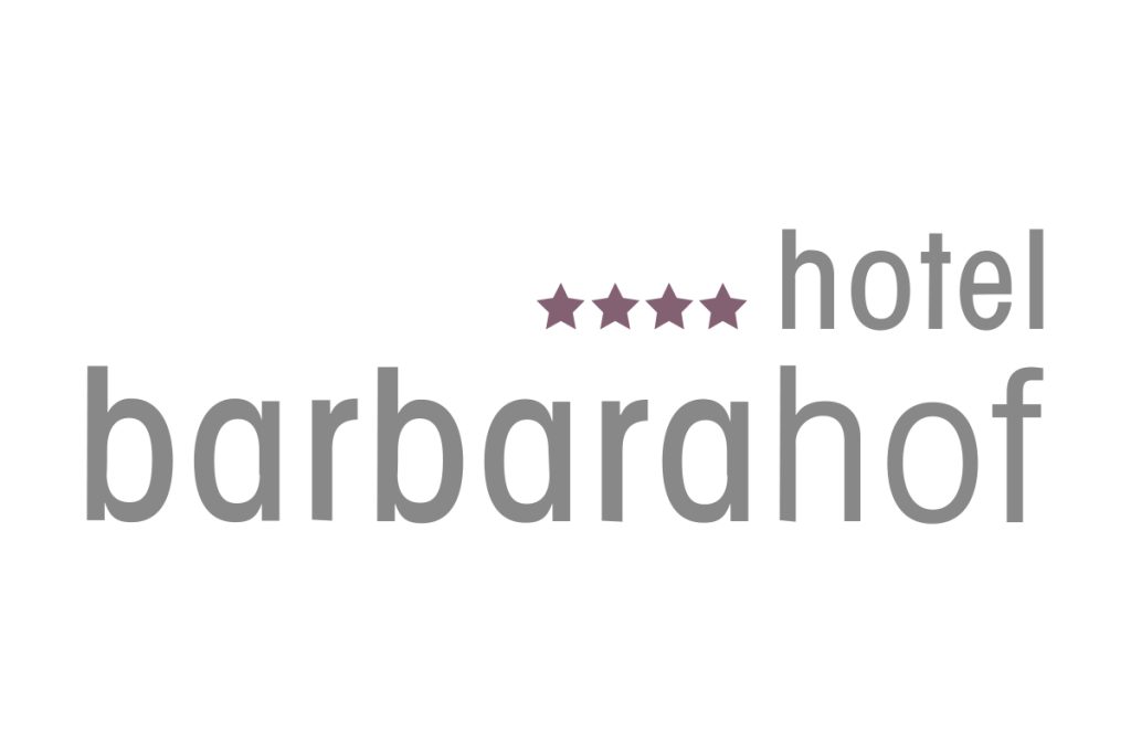 Logo Hotel Barbarahof mit vier lilafarbenen Sternen und grauer Schrift